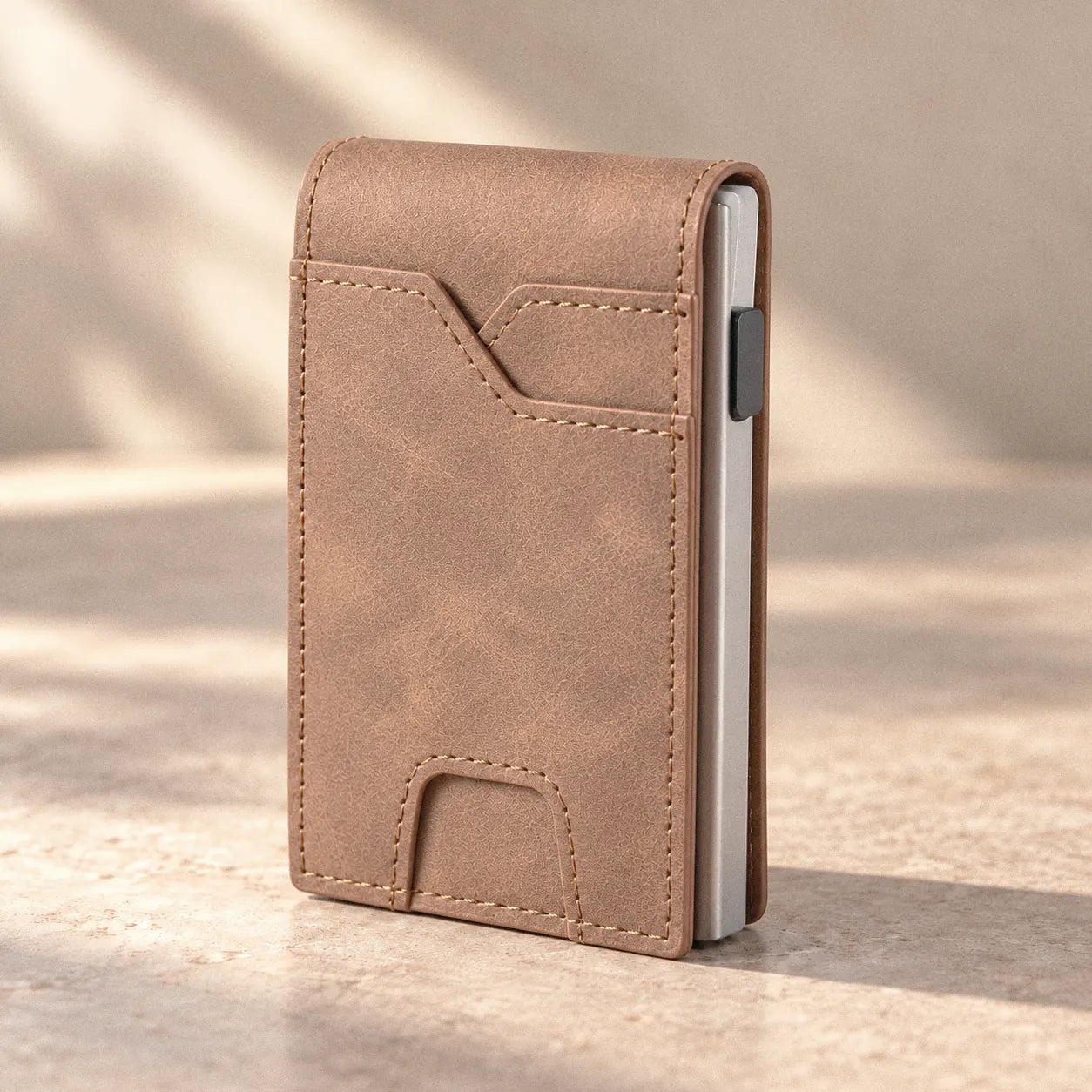 Foldwell Pop-Up Bifold in Brown on a stone surface