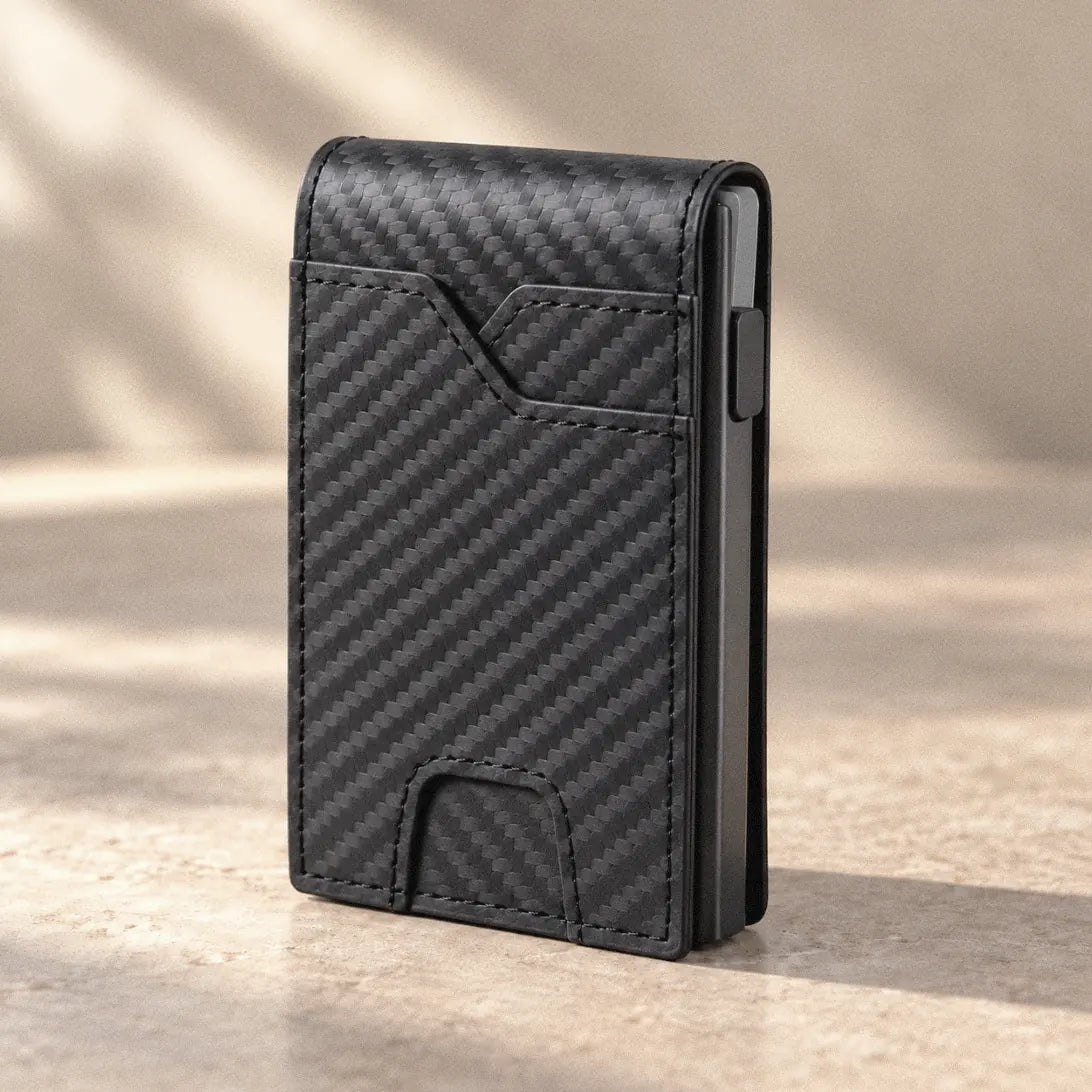 Foldwell Pop-Up Bifold in Carbon Black on a stone surface